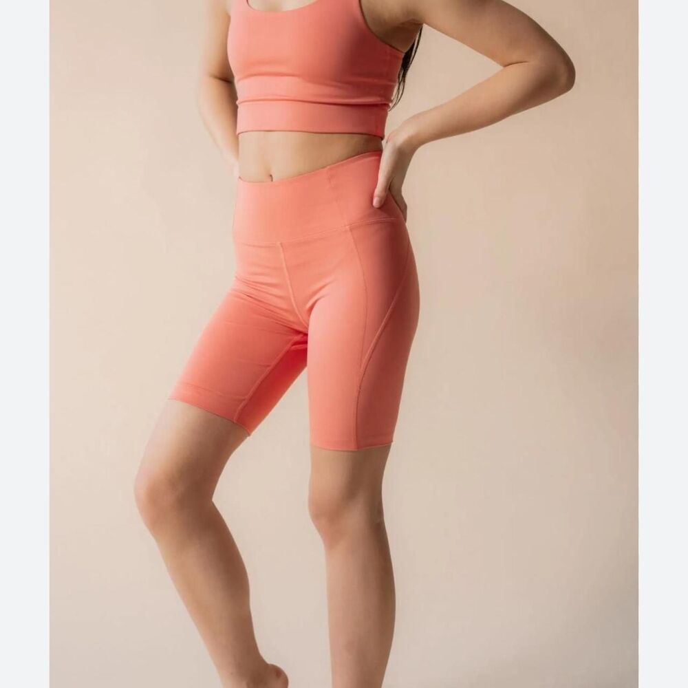 Girlfriend Collective orange/pink colored high rise biker shorts Small